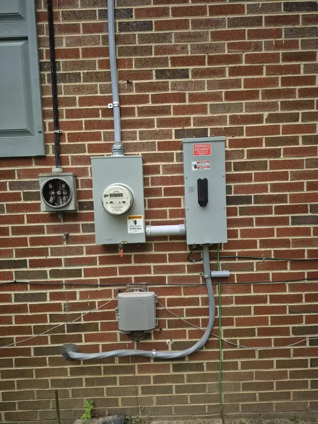 Electrical meter base and emergency disconnect installed by Flash Power